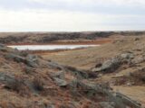 rock bluffs along reservoir shoreline