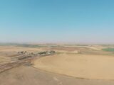 View of feedlot and pivot from SE to NE